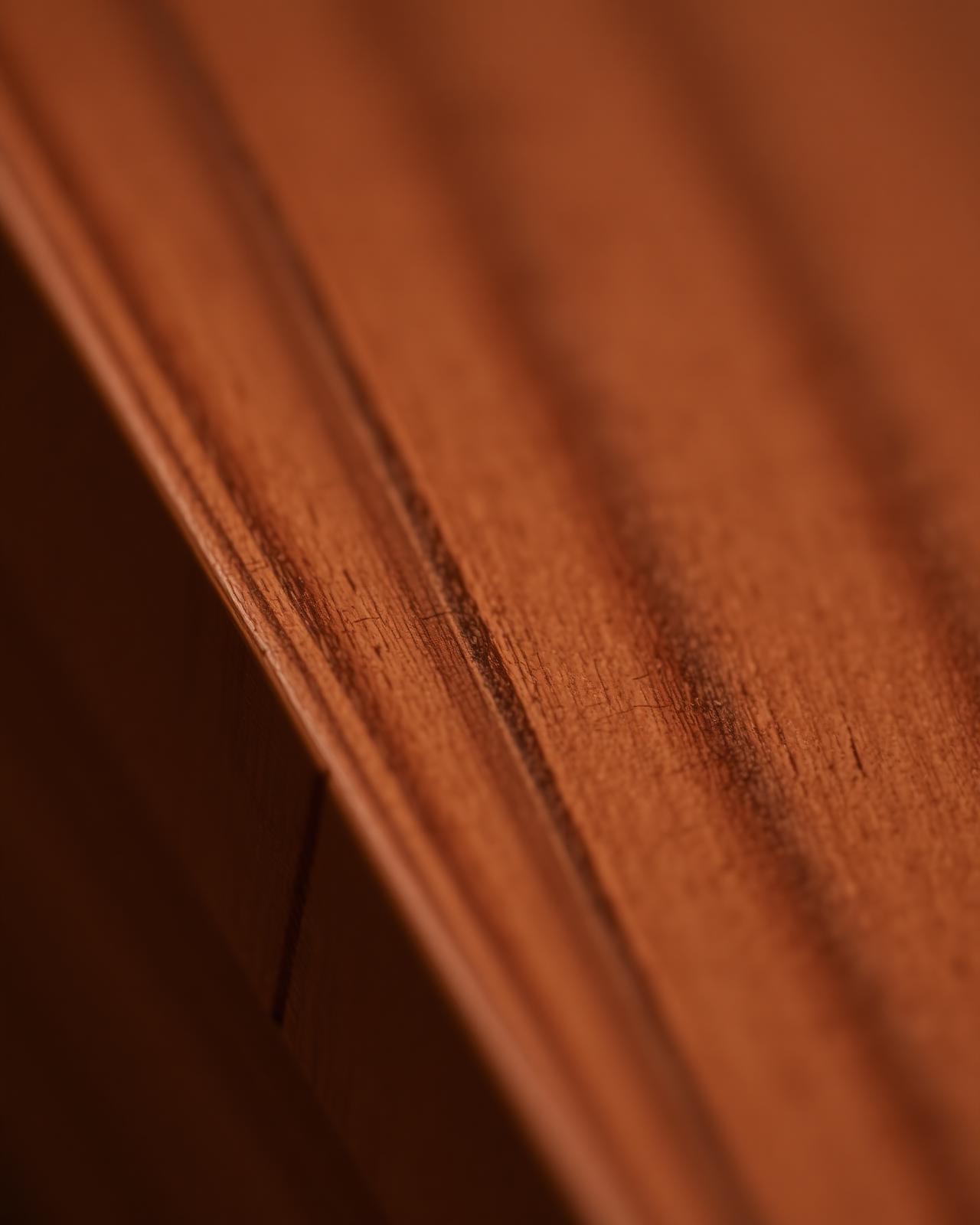 Macro detail of machined walnut millwork edge
